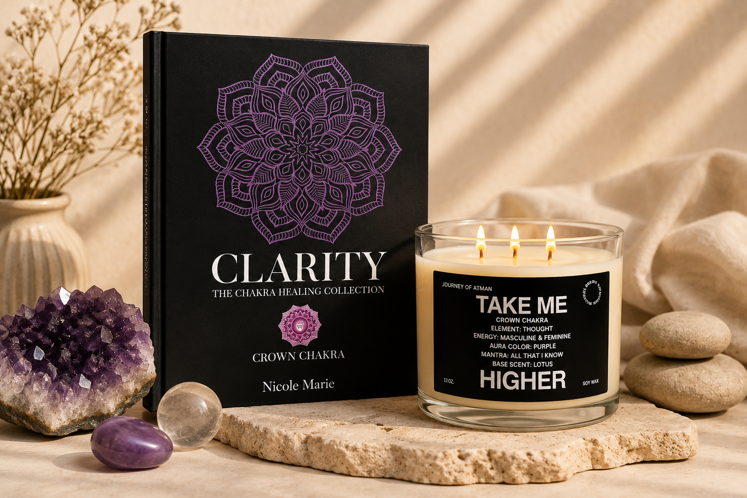 Crowd chakra healing bundle by Journey of Atman featuring the Clarity journal and Take Me Higher affirmation candle styled in a warm luxury wellness setting with amethyst accents, stacked stones, and soft ambient light.