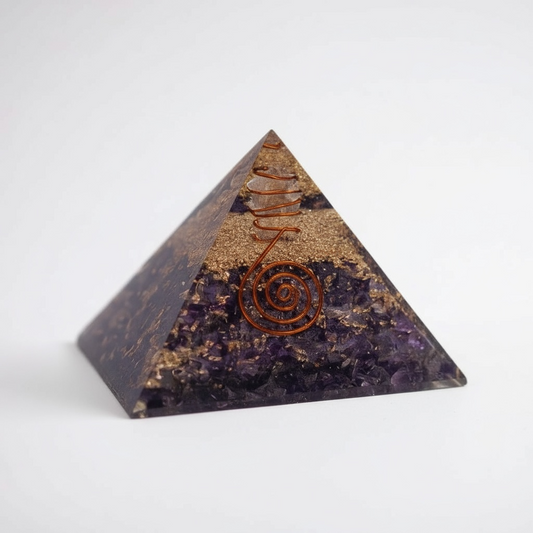 Amethyst orgonite pyramid for energy cleansing and chakra balancing, featuring layered resin, metal, and natural amethyst to promote spiritual protection, intuition, and harmonious energy flow.