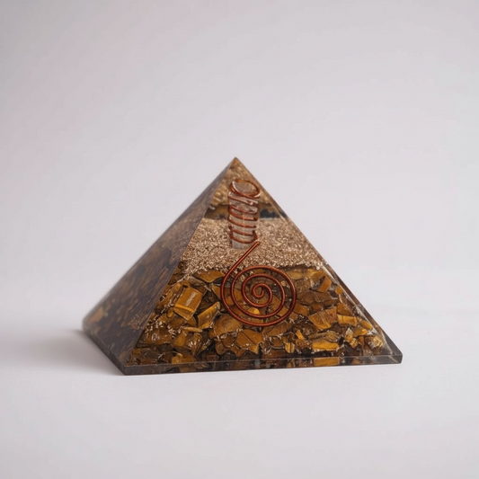 Tiger’s Eye orgonite pyramid for Solar Plexus Chakra healing, crafted with layered resin, metal, and natural tiger’s eye gemstone to support confidence, personal power, focus, and energetic balance.
