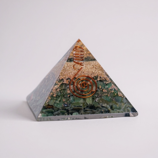 Green Aventurine orgonite pyramid for heart chakra healing, crafted with layered resin, metal, and natural aventurine to support emotional balance, prosperity, and gentle energy harmonization.