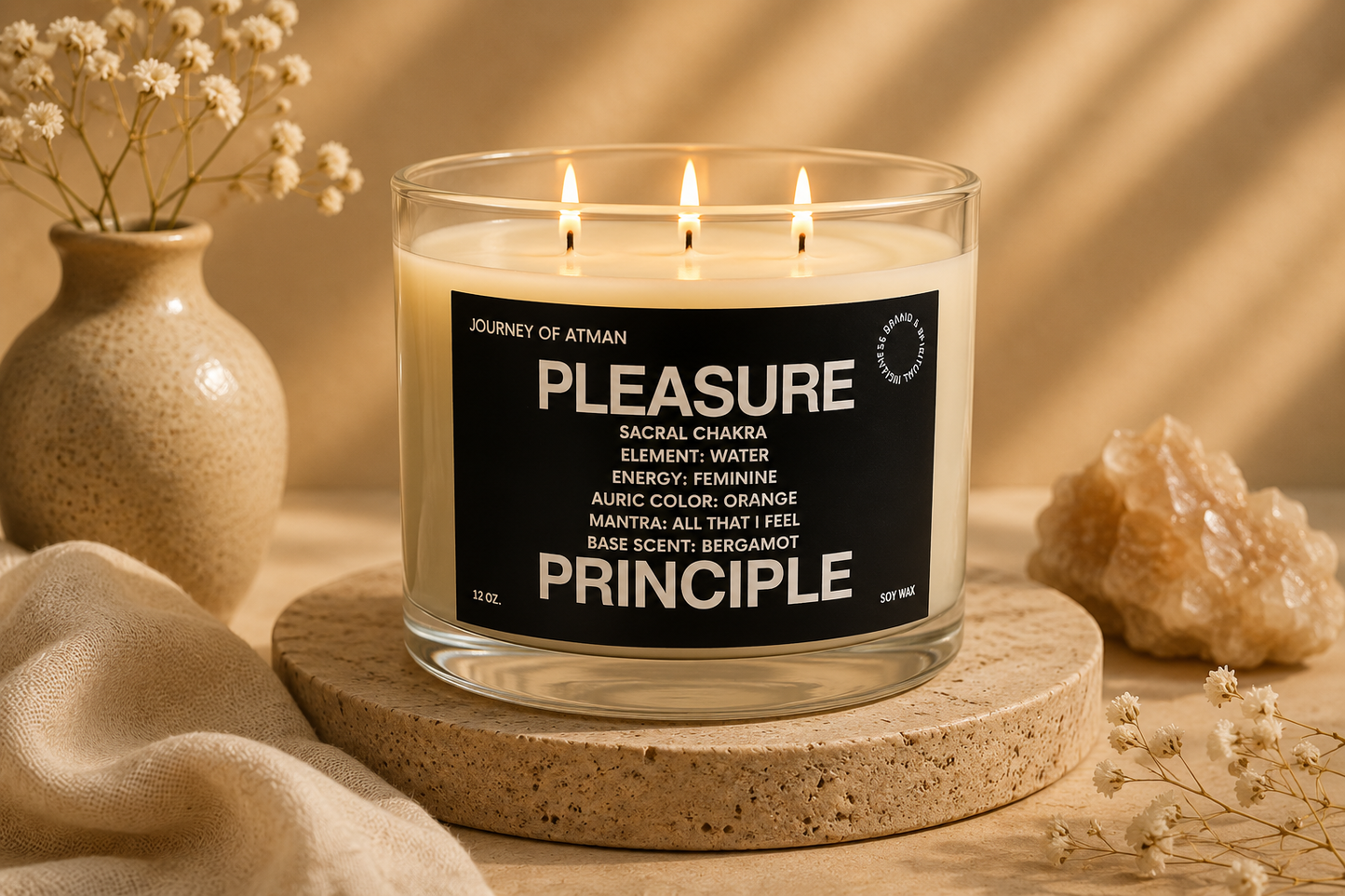 Pleasure Principle sacral chakra candle by Journey of Atman styled in a warm ritual-inspired setting with soft neutral textures, stone pedestal, and glowing candlelight.