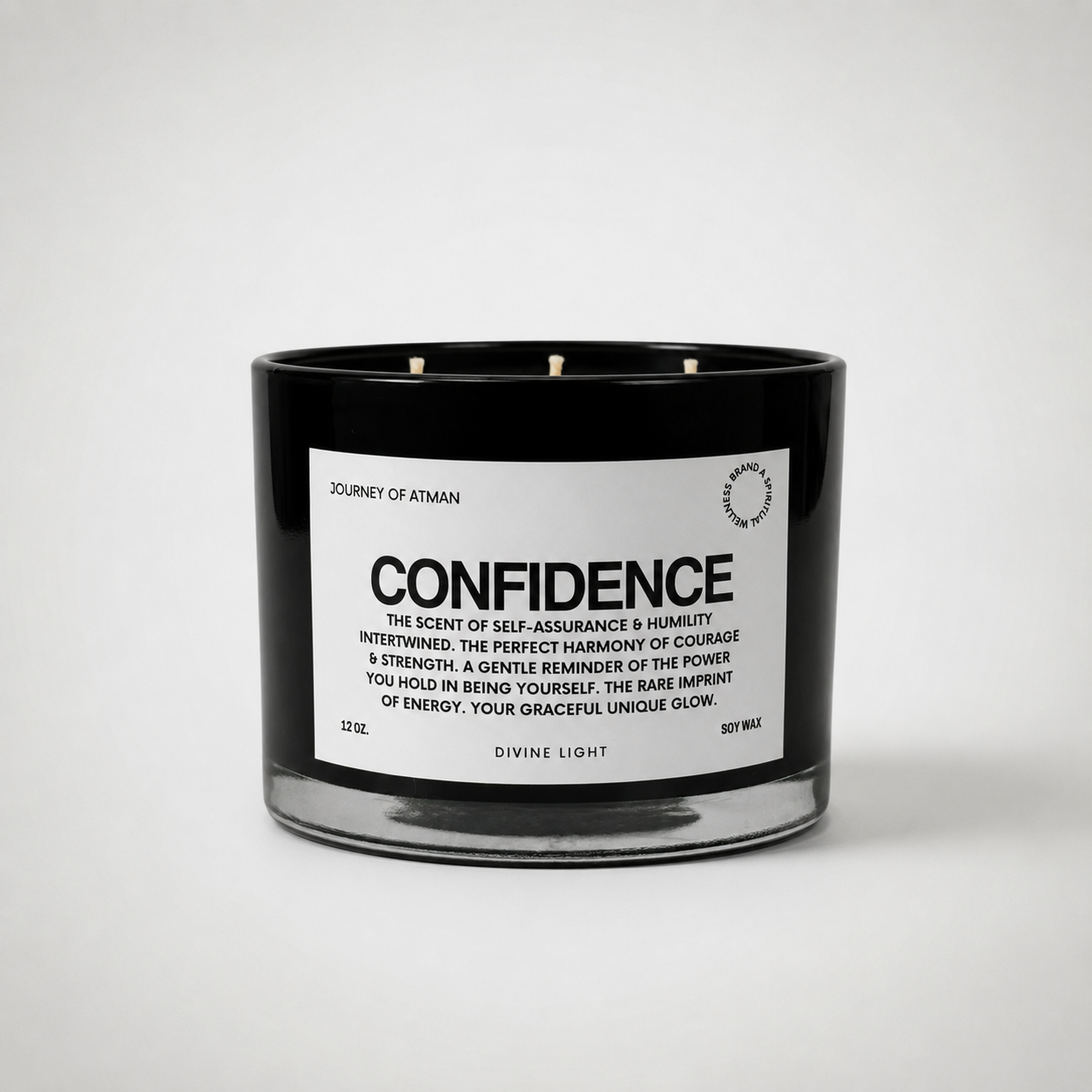 Confidence affirmation candle in black glass vessel with white label on clean white background supporting self-assurance, courage, and empowerment.