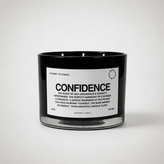 Confidence affirmation candle in black glass vessel with white label on clean white background supporting self-assurance, courage, and empowerment.