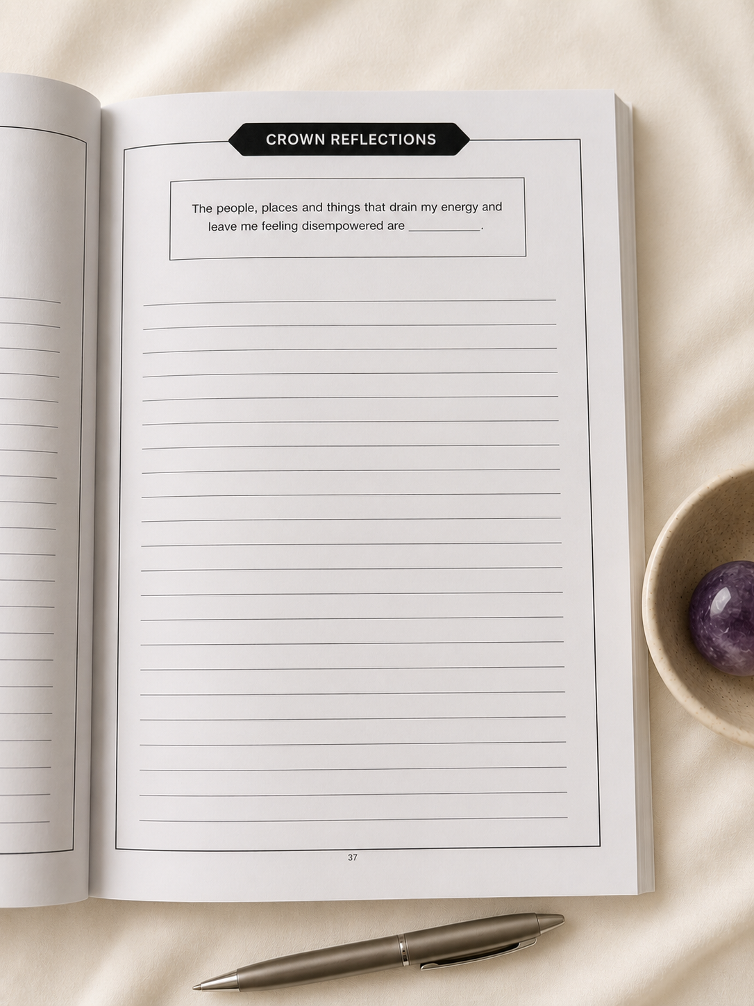 Crown Chakra guided reflection journal page styled in soft cream lifestyle scene with amethyst crystal and minimalist pen.