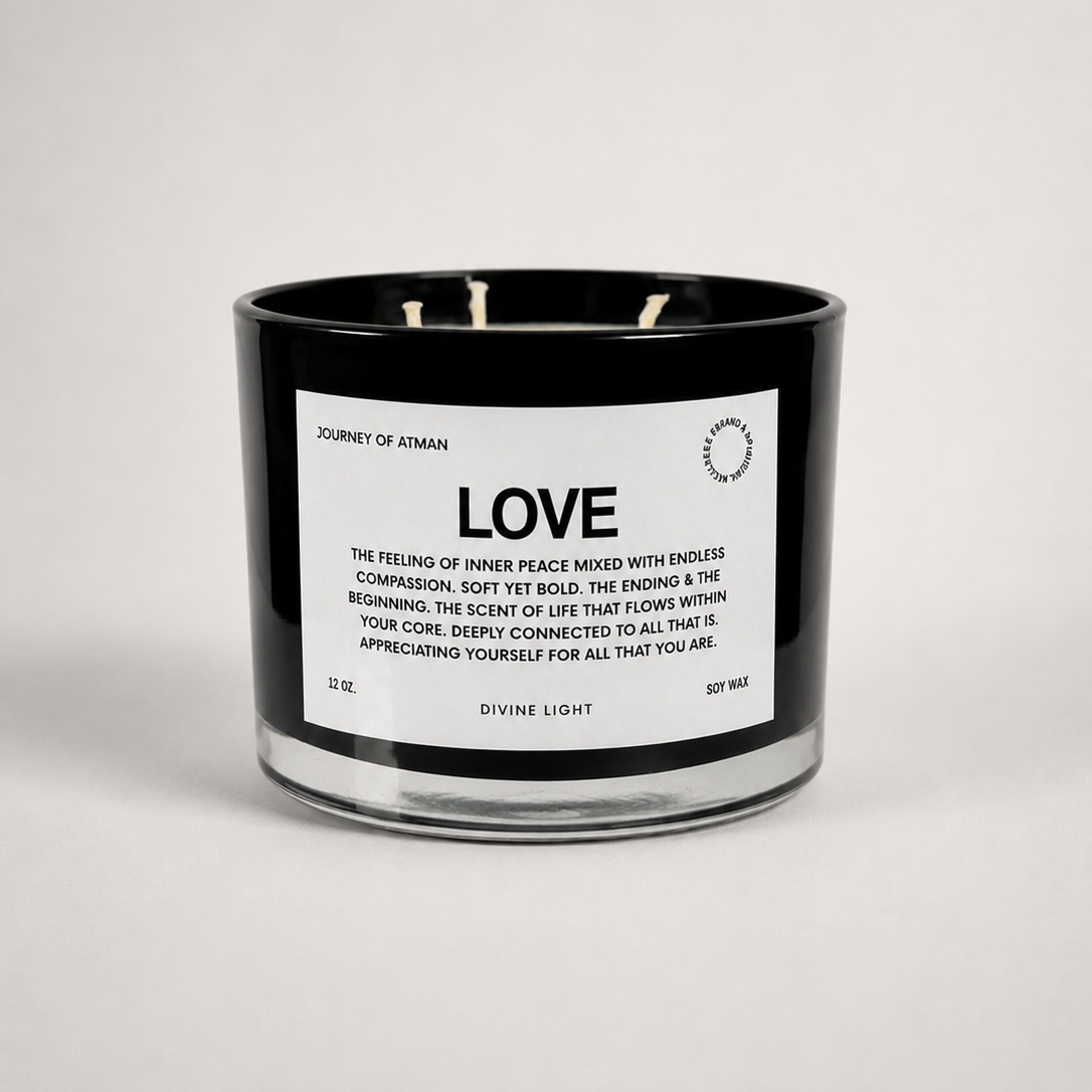 Abundance affirmation candle in black glass vessel with white label on clean white background for manifestation and intentional self-reflection.