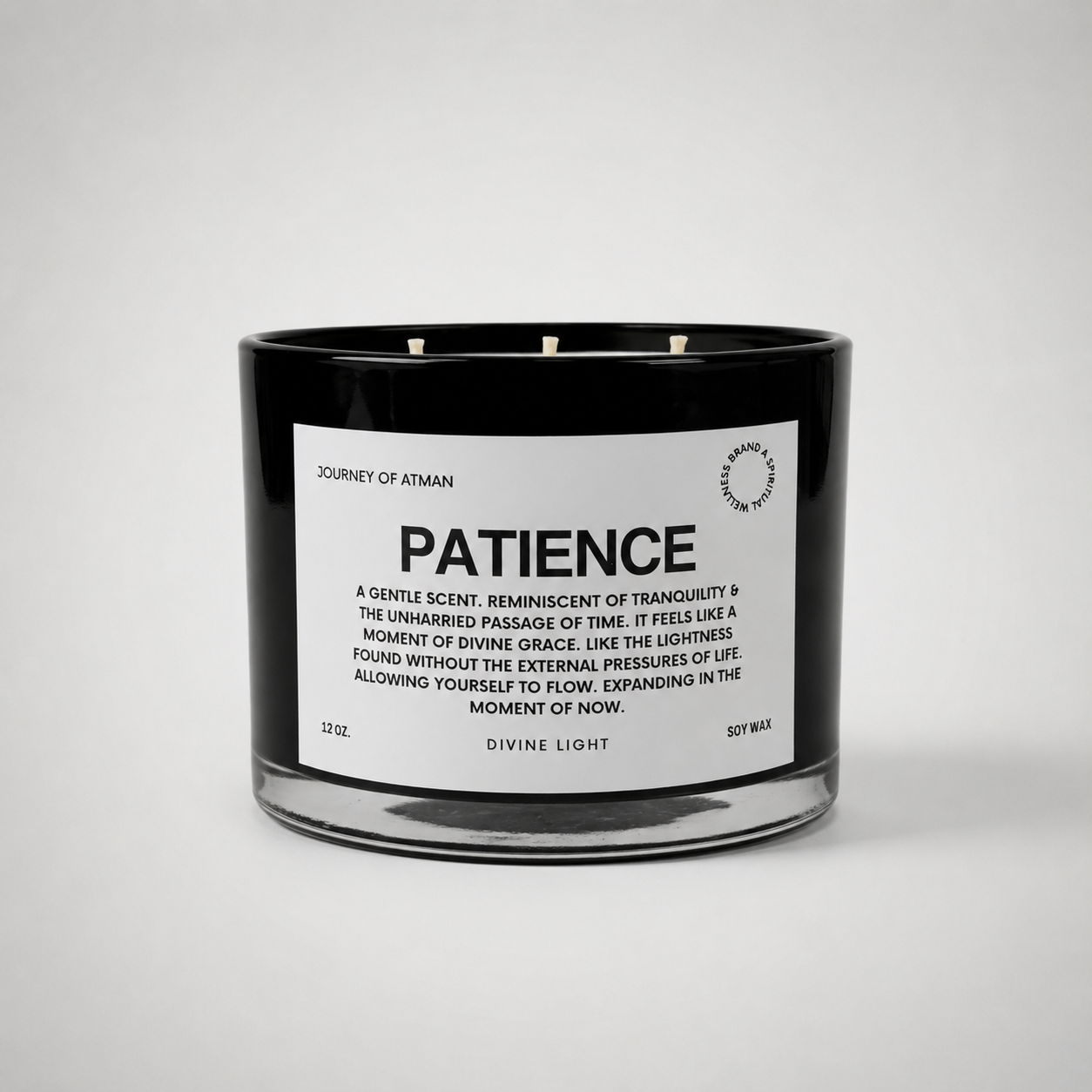 Patience affirmation candle in black glass vessel with white label on clean white background for mindfulness, trust, and emotional steadiness.