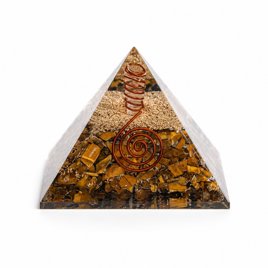 Tiger’s eye orgonite pyramid with copper spiral and crystal layers on clean white background by Journey of Atman.