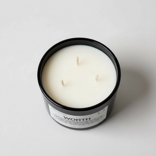 worth affirmation candle top view in black glass vessel with three wicks and minimalist label design – spiritual wellness candle by Journey of Atman