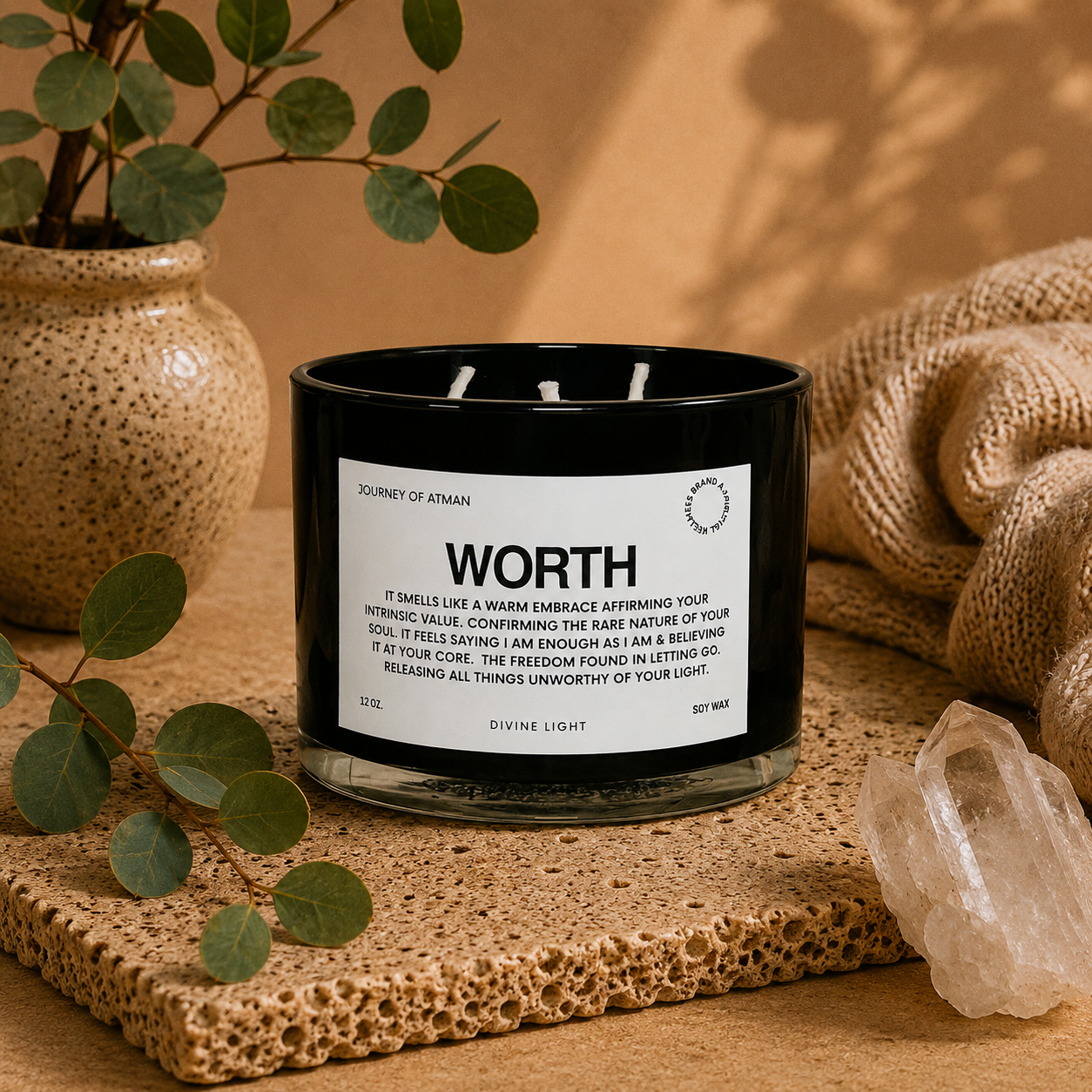 Worth affirmation candle in warm lifestyle setting with crystal, eucalyptus, and soft neutral décor supporting self-worth and confidence.